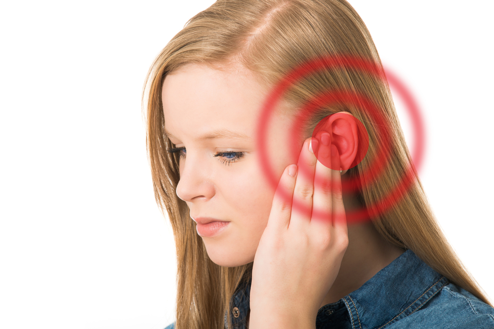 A pulsing sound experienced in the ear